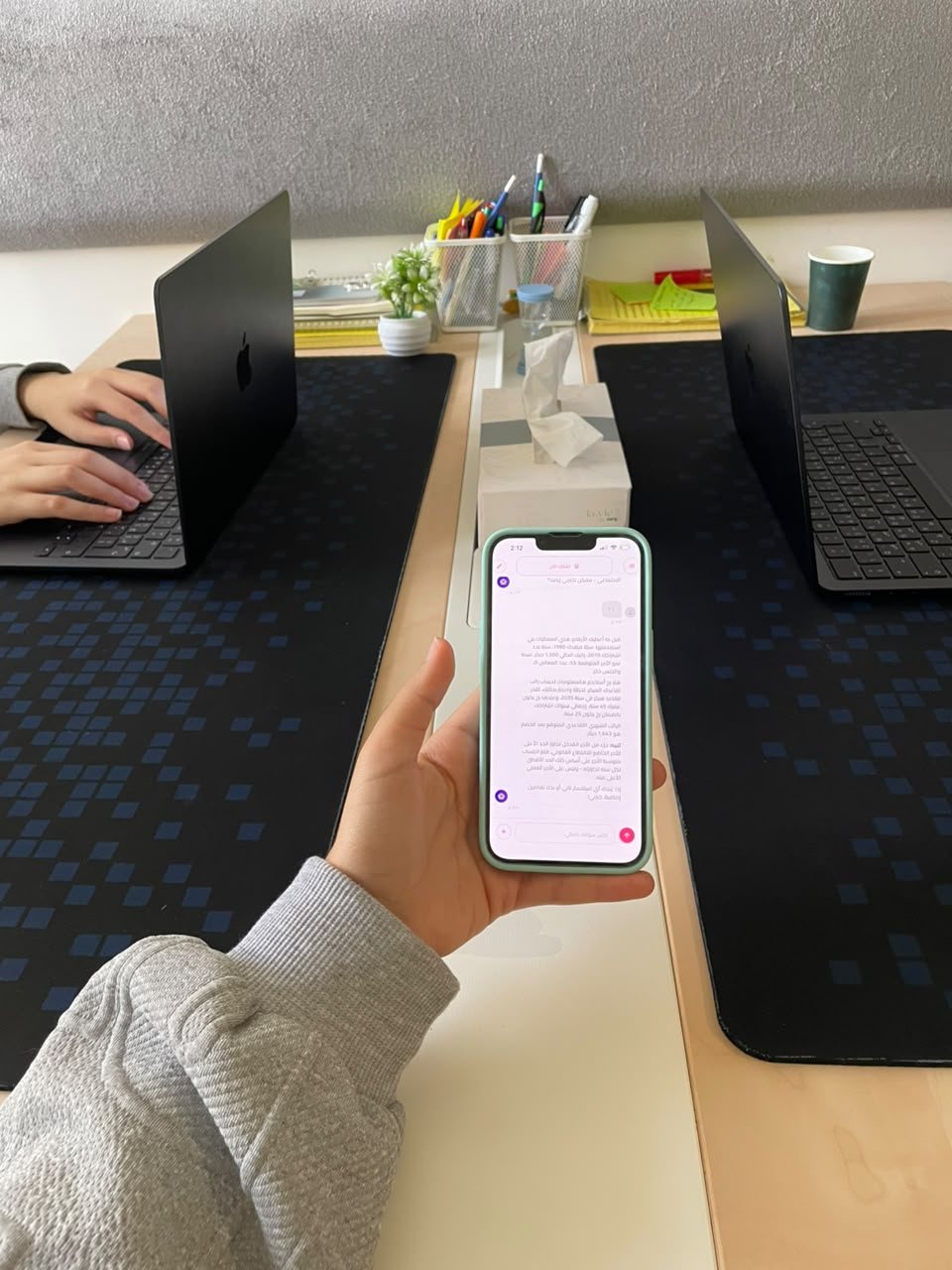 Ana A Kabar open on a phone at the DigiOps studio desk